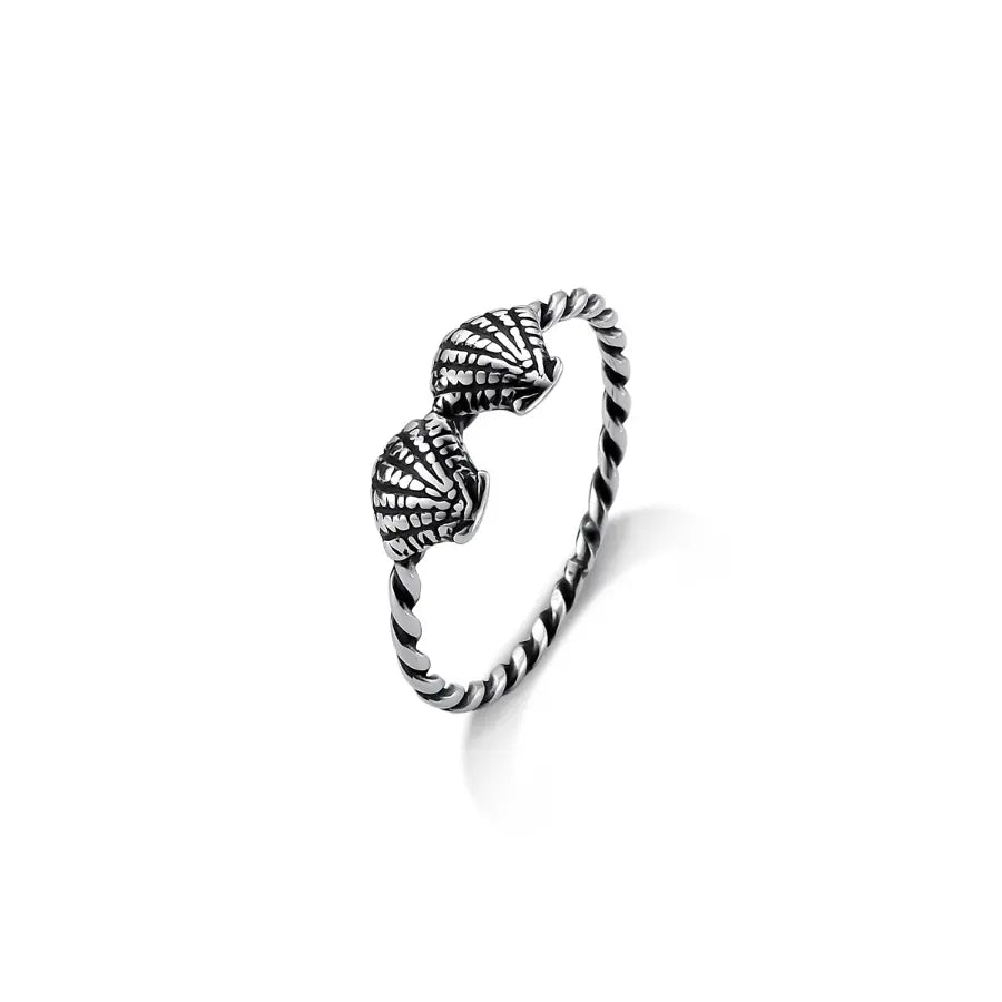 Twin cowrie with twisted band ring